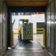 Forklift loading a shipping container
